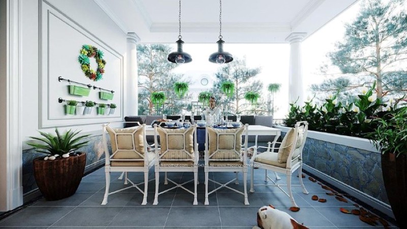 Sắp xếp không gian ăn uống ngoài trời đẹp mắt với hệ thống cây xanh tươi mát cùng bộ bàn ghế ăn êm ái. Thiết kế nội thất cao cấp